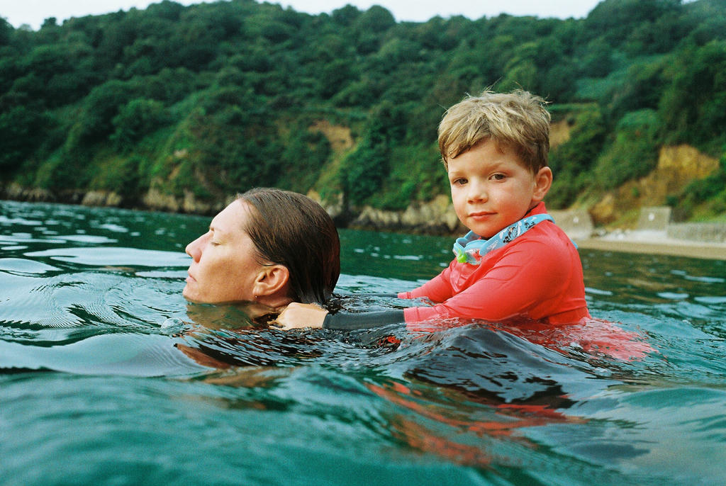 Bel and Jack swimming at Fermain bay, Guernsey