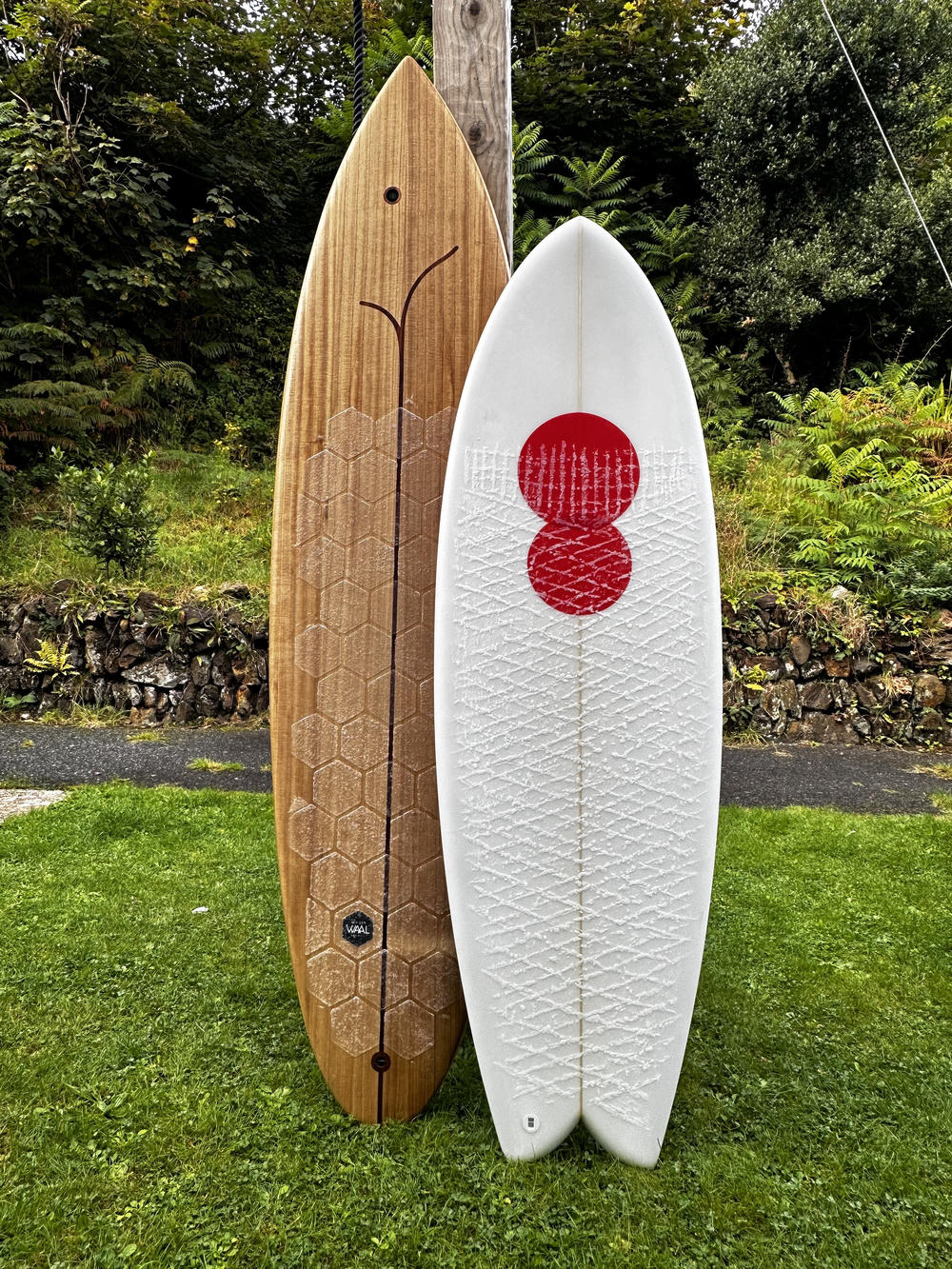 Two surfboards. Wooden 6'8 Bosiny Flagship and Cooper 5'7 Electric Twin