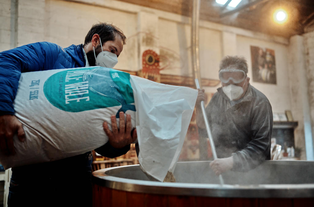 Mixing the grains with hot water at Dynamite Valley Brewing Co.