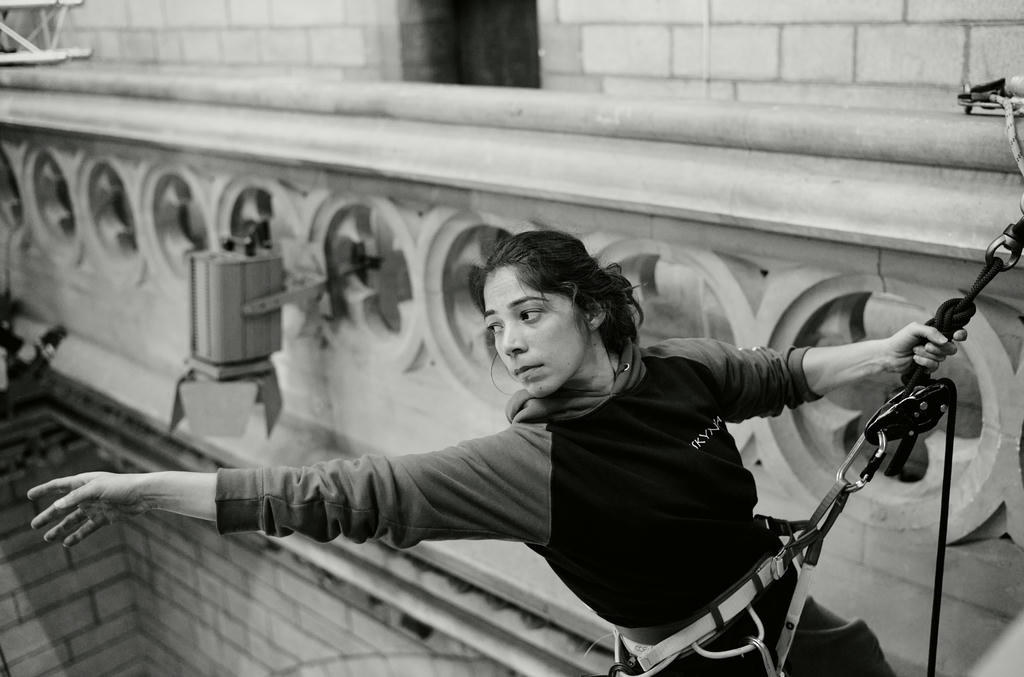 Ishita Raina from Yskynna Vertical Dance Company warming up at rehearsal in Truro Cathedral