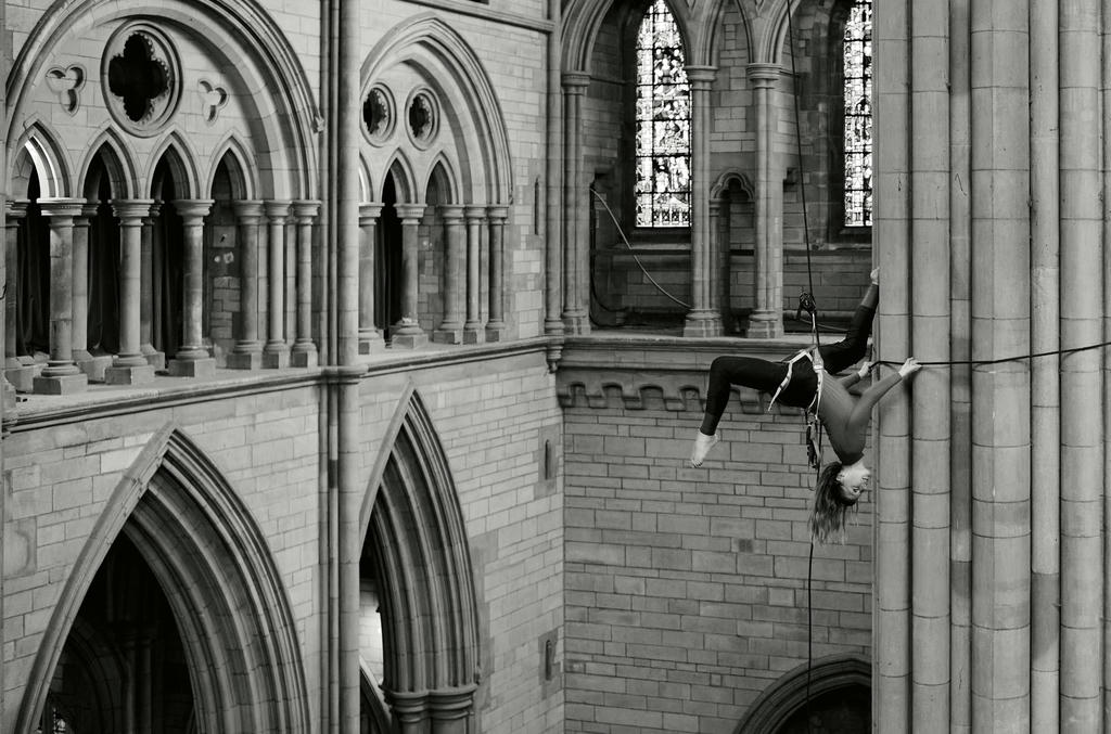 Georgie Barnett from Yskynna Vertical Dance Company warming up at rehearsal in Truro Cathedral