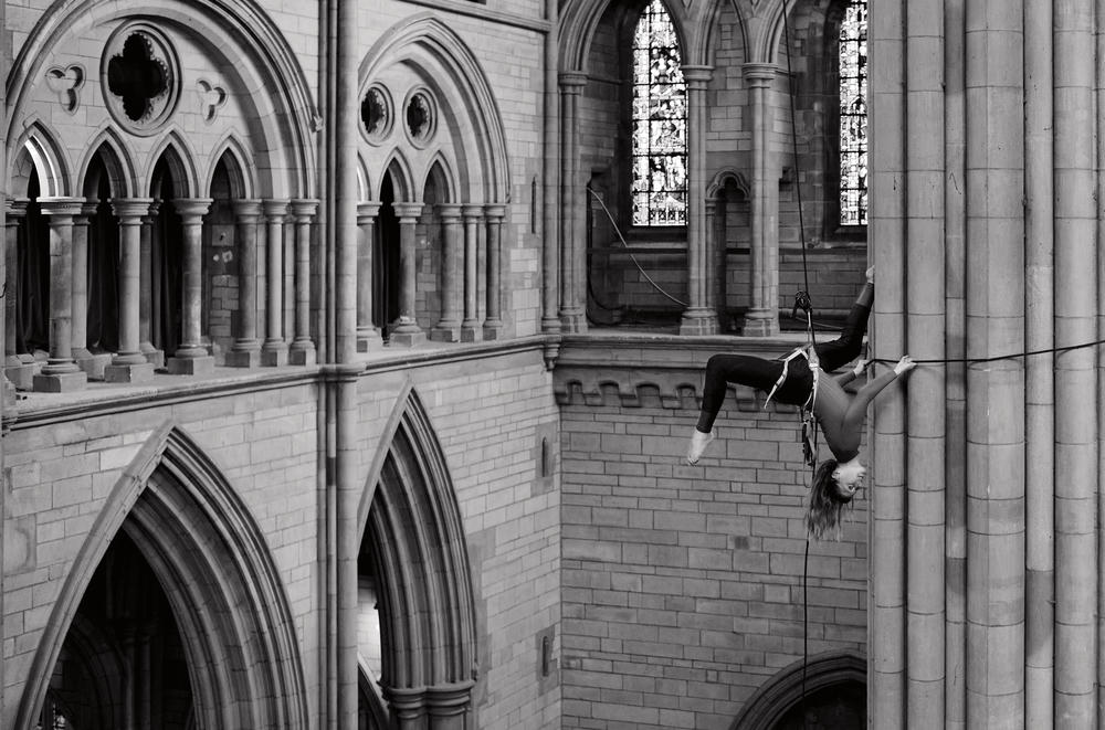 Georgie Barnett from Yskynna Vertical Dance Company warming up at rehearsal in Truro Cathedral